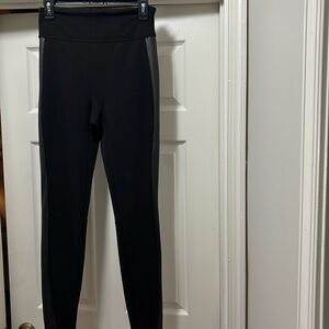 Spanx full length black leggings with faux leather  detail at the sides.